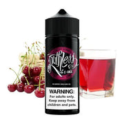 A 100ml bottle of Ruthless Cherry Drank e-liquid with a label showing the brand name and a warning sign indicating the product is for adults only. There are cherries and a glass of red liquid in the background.